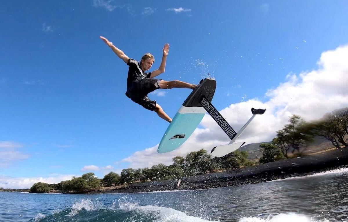 Surfer on electric hydrofoil board midair